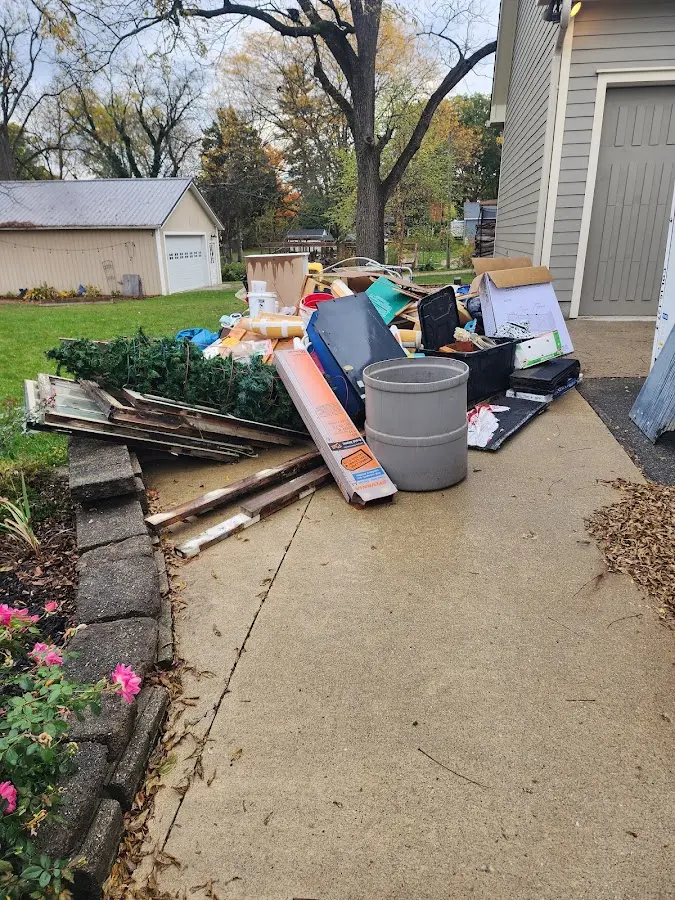 Dumpster being loaded with debris for 3 Yard Dumpster Rental in Doylestown